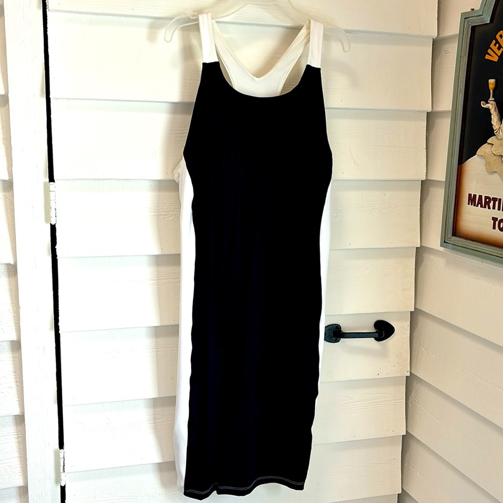 Athleta sport. Lycra w built in bra. Black & White, mid thigh length, stretchy.
